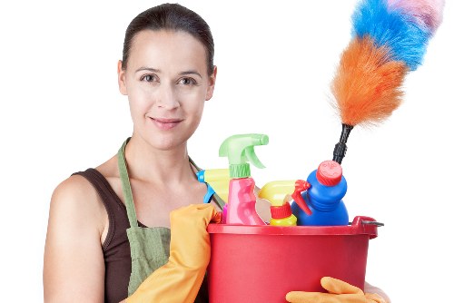 Professional upholstery cleaning process on a living room sofa