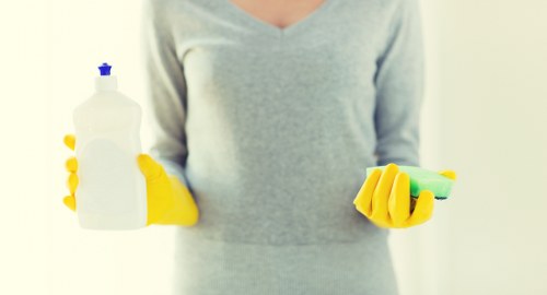 Professional house cleaning in a bright living room