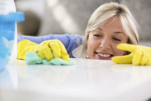Technician applying stain treatment during mattress cleaning
