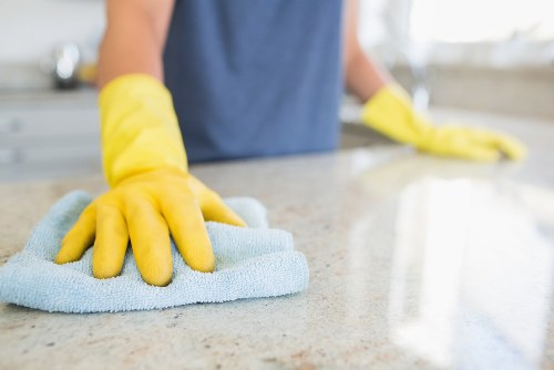 Kitchen surfaces being cleaned as part of domestic cleaning